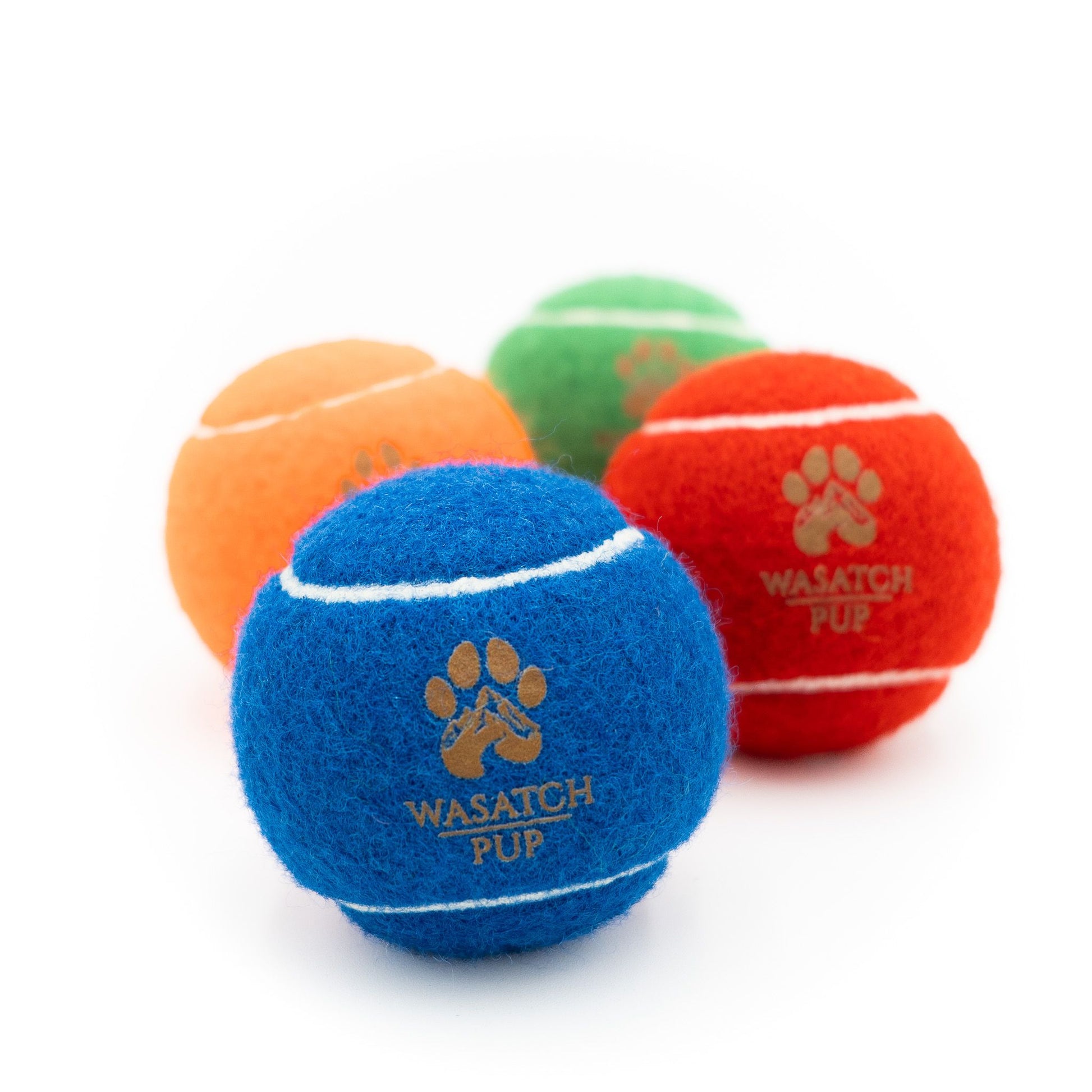 4 colors of tennis balls with wasatch pup logo in the center of the ball. Squeaky tennis balls